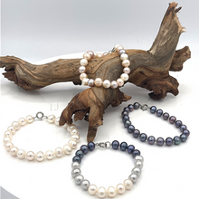 Load image into Gallery viewer, Fresh water pearl knotted silver bracelet