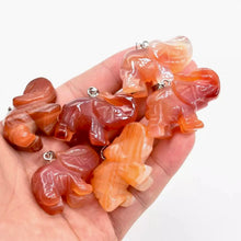 Load image into Gallery viewer, Carnelian Elephant figure pendants on a hand