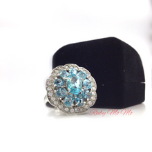 Load image into Gallery viewer, Aquamarine oval cut stones in flower shaped sterling silver setting ring with diamonique
