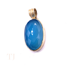 Load image into Gallery viewer, Blue Calcedony faceted oval shape in a sterling silver setting pendant with a bail