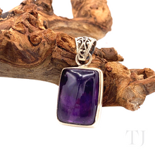 Load image into Gallery viewer, Amethyst square cabochon in sterling silver lying on a branch'