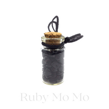 Load image into Gallery viewer, Black Onyx small stones in a bottle being made into a necklace with leather chain