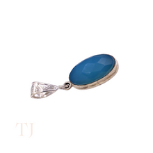 Load image into Gallery viewer, Blue Calcedony faceted oval shape in a sterling silver setting pendant with a bail