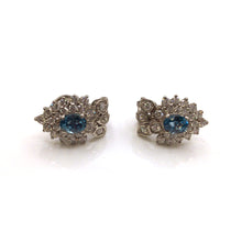 Load image into Gallery viewer, Blue Topaz Oval cut stones in sterling silver setting earrings with diamonique