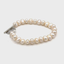 Load and play video in Gallery viewer, White round pearl bracelet with metal heart lock (7 mm)
