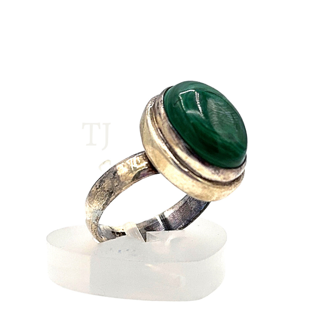 Malachite stone in oval shaped silver setting