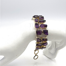 Load image into Gallery viewer, High Quality Amethyst Faceted cut stones bracelet in sterling silver being hung on the doll&#39;s hand
