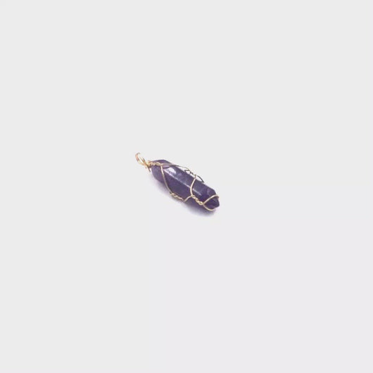 video of Amethyst point pendant with gold wire wrap