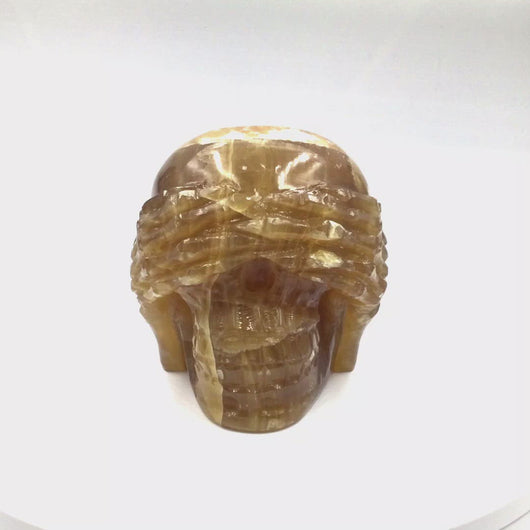 360 video of Citrine Calcite Skull head (3 Wise Monkeys set)