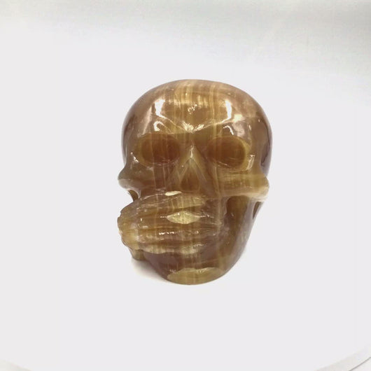 360 video of Citrine Calcite Skull head (3 Wise Monkeys set)