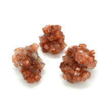 将图片加载到图库查看器，Three Aragonite star clusters 
