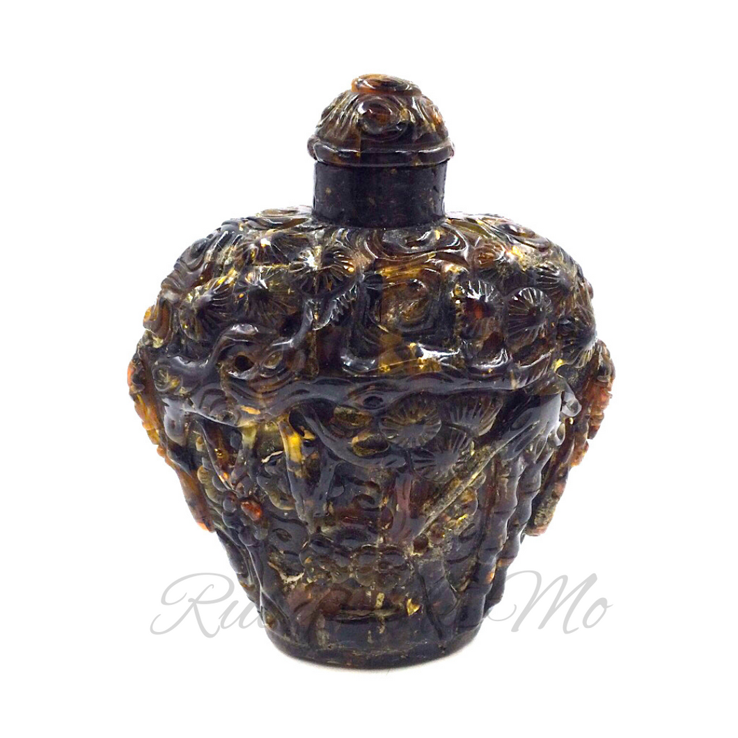 Misty Forest: A Hand-Carved Amber Snuff Bottle