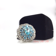 Load image into Gallery viewer, Aquamarine oval cut stones in flower shaped sterling silver setting ring with diamonique
