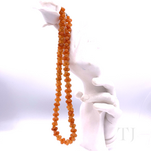 Cargar imagen en el visor de la galería, carnelian smooth cluster necklace with lobster clasp on a doll&#39;s hand
