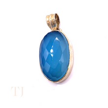 Загрузить изображение в средство просмотра галереи, Blue Calcedony faceted oval shape in a sterling silver setting pendant with a bail
