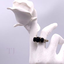 Load image into Gallery viewer, Three Black Onyx Cabochon stones in sterling silver setting ring on a doll&#39;s hand
