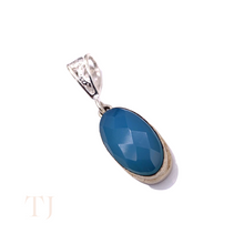 Загрузить изображение в средство просмотра галереи, Blue Calcedony faceted oval shape in a sterling silver setting pendant with a bail
