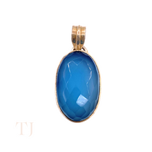 Загрузить изображение в средство просмотра галереи, Blue Calcedony faceted oval shape in a sterling silver setting pendant with a bail
