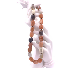 Load image into Gallery viewer, Agate stone necklace hanging on the hand of the doll
